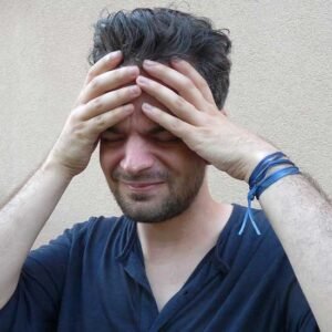 man holding head